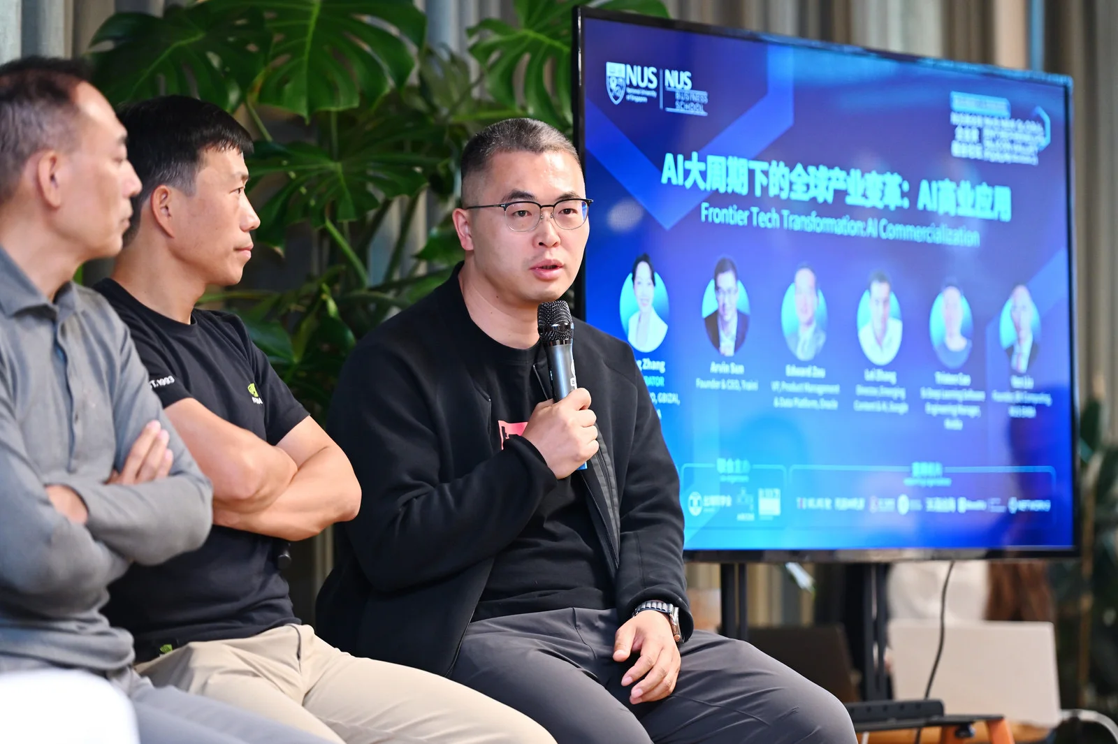 Traini team speaking at an event