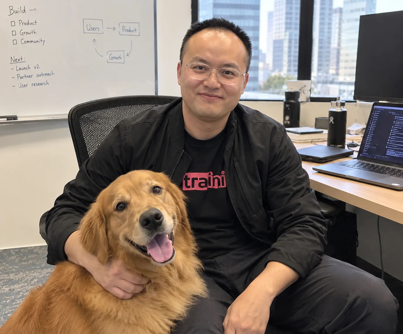 Traini team member holding a dog